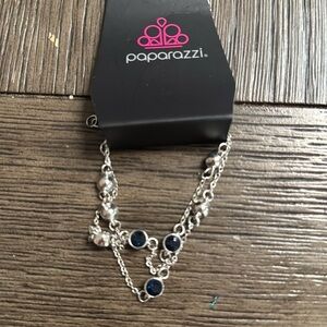 Dangling bracelet with blue stone design